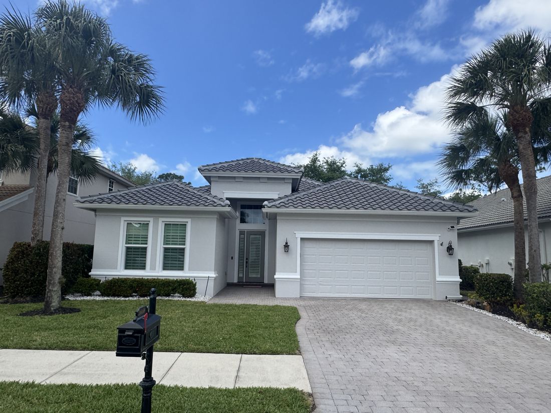 Before and after exterior repaint of an Estero home